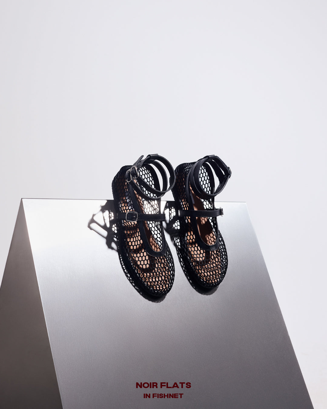 NOIR FLATS IN FISHNET